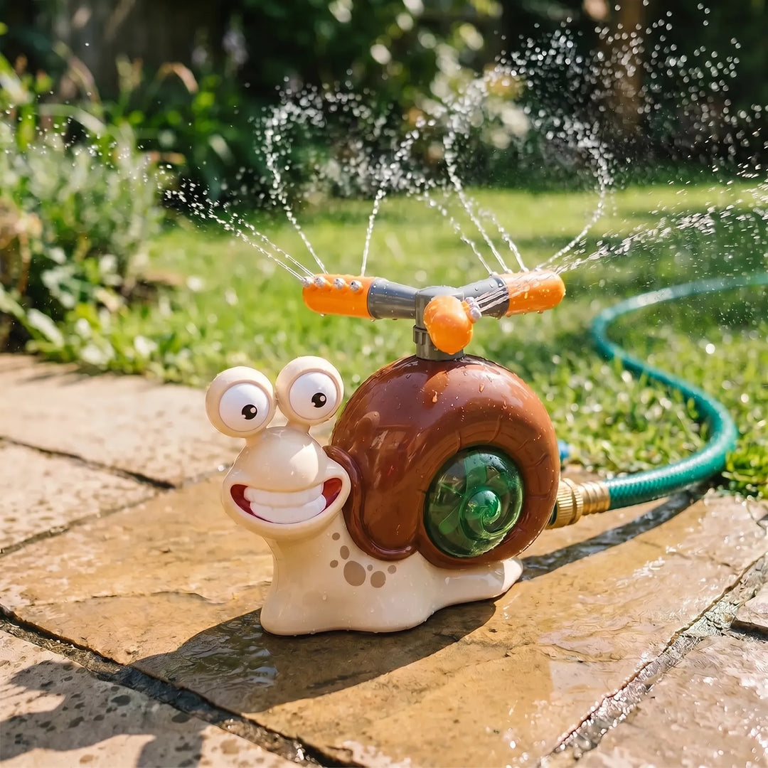 Adorable snail water sprinkler toy spraying water, perfect for cooling kids down in the garden.