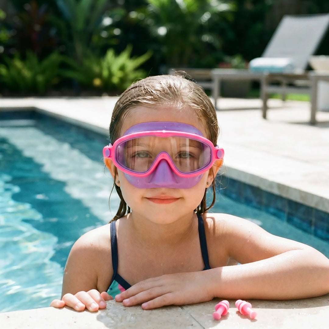Kids' comfort swim mask with integrated nose cover, clear lens, and adjustable silicone strap for swimming.