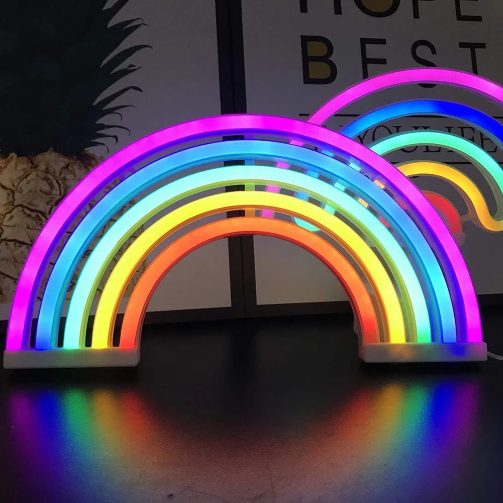 Cozy neon rainbow table lamp for kids, providing gentle, colorful light. Perfect nursery or bedroom decor.