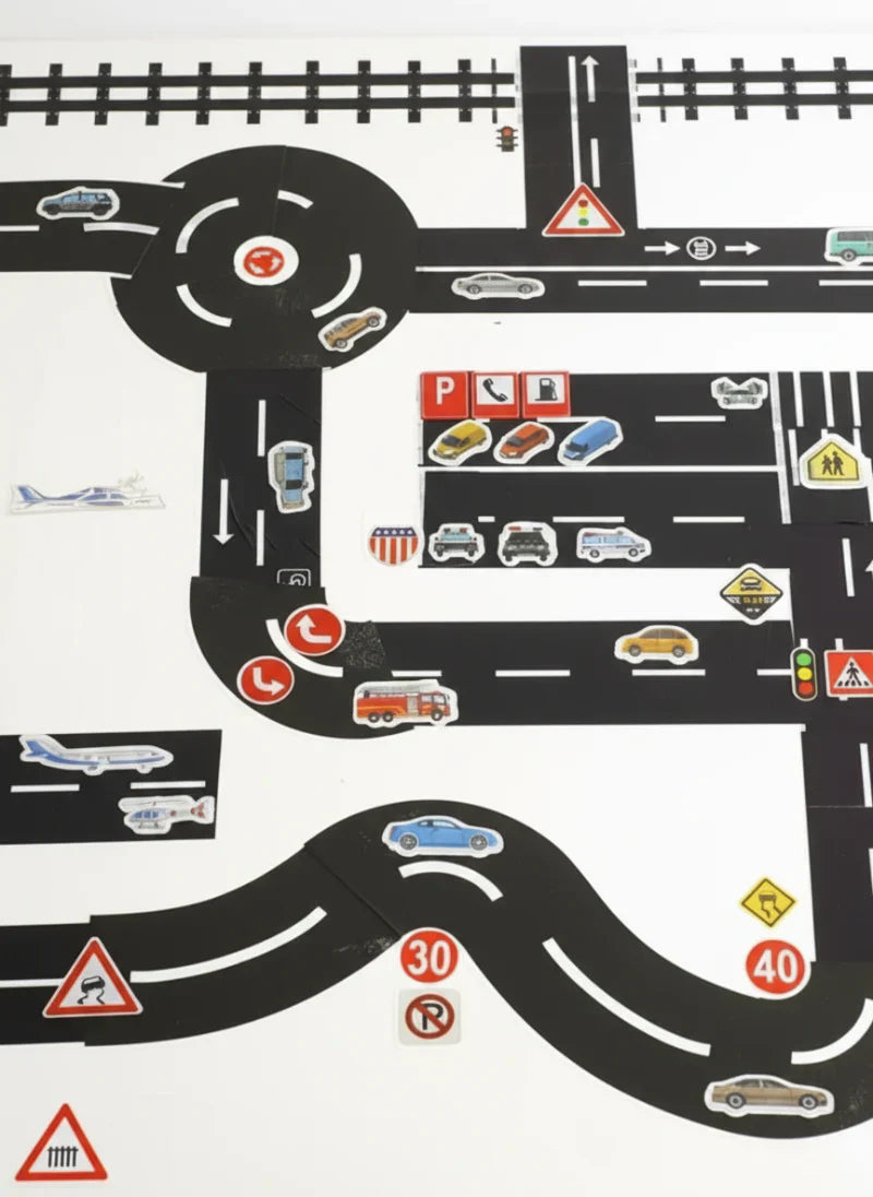 Close-up of a child's hands playing with the Road Play Tape and a toy car on a floor