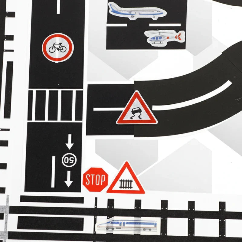 Overhead view of an intricate road play tape layout with multiple intersections and curves
