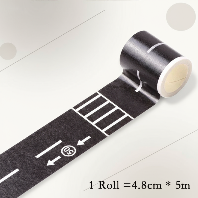 Road play tape roll next to a sheet of colorful traffic sign stickers for kids' play