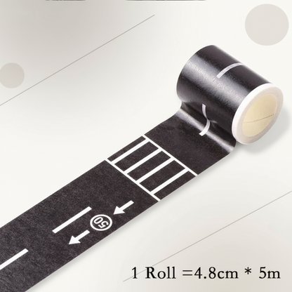 Road play tape roll next to a sheet of colorful traffic sign stickers for kids' play