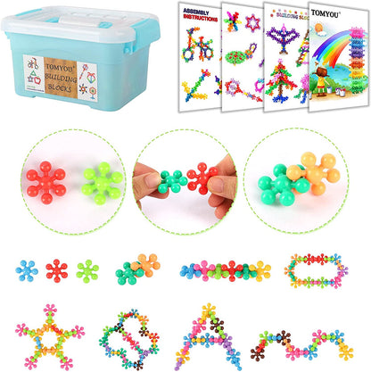 Close-up of a child's hands assembling vibrant snowflake building blocks, fostering creativity