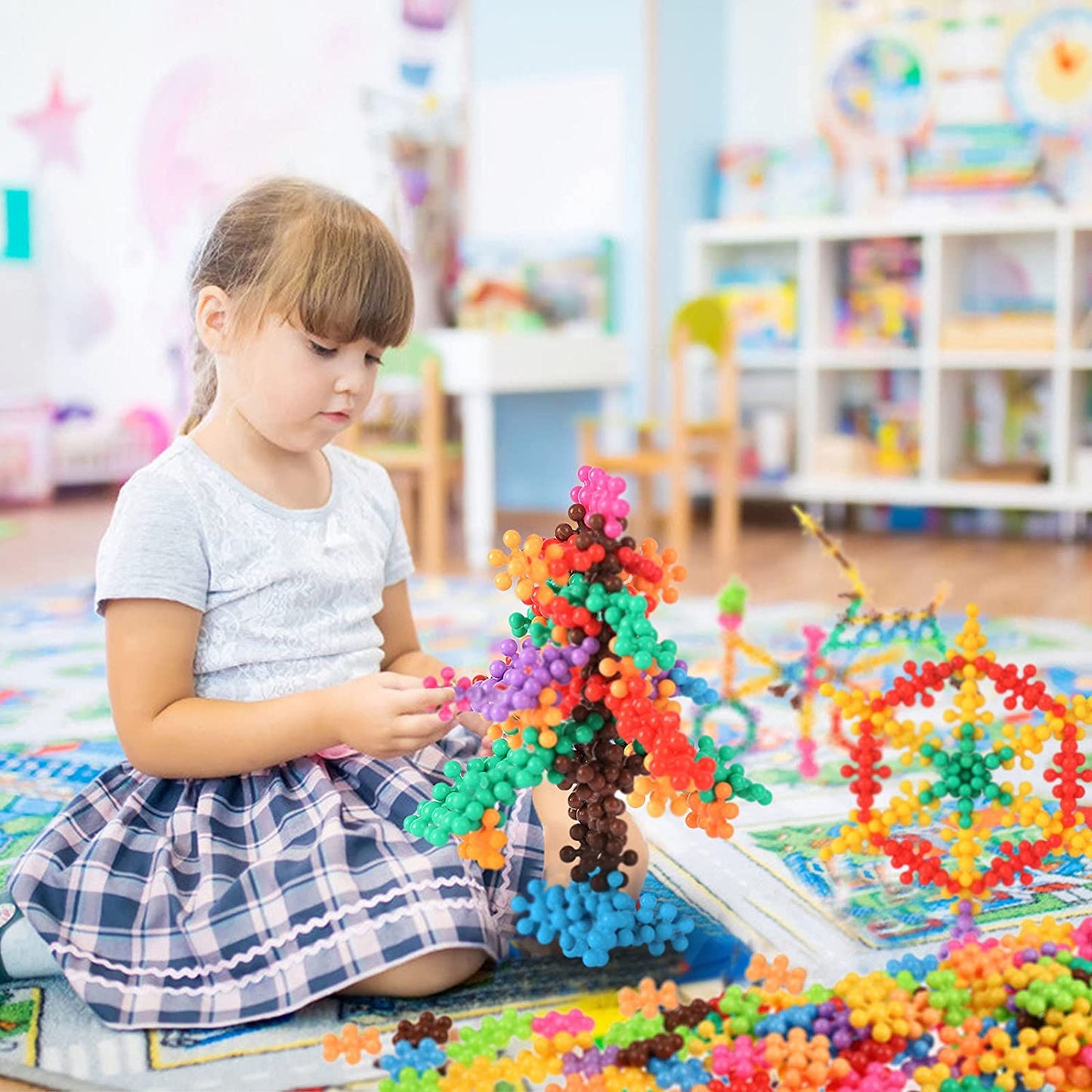 Kids' playtime with snowflake building blocks, highlighting creative play and fine motor skills
