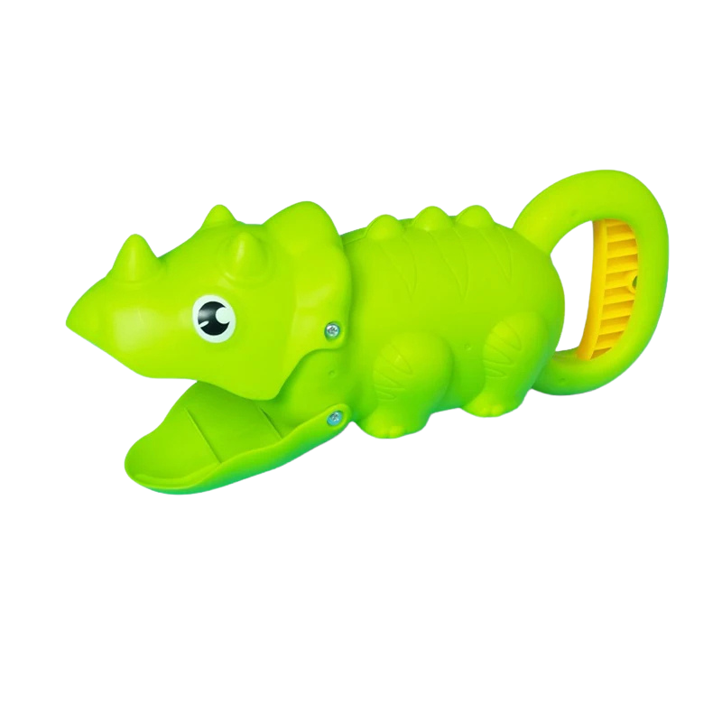 Boy happily catching a toy bug with a critter grabber, enhancing motor skills outdoors