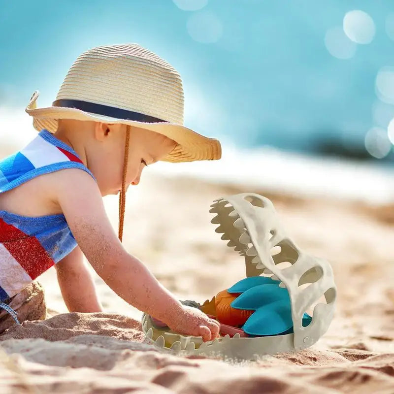 Child happily digging in sand with a yellow spade and dinosaur bucket, engaging in outdoor activity