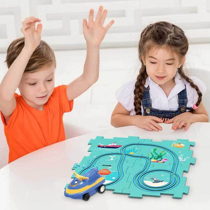 Young boy concentrating on connecting track pieces for his DIY electric car puzzle set, creative STEM learning