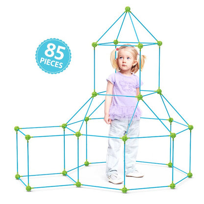 Educational construction toy: a child proudly standing inside a fort built with a DIY fort building kit