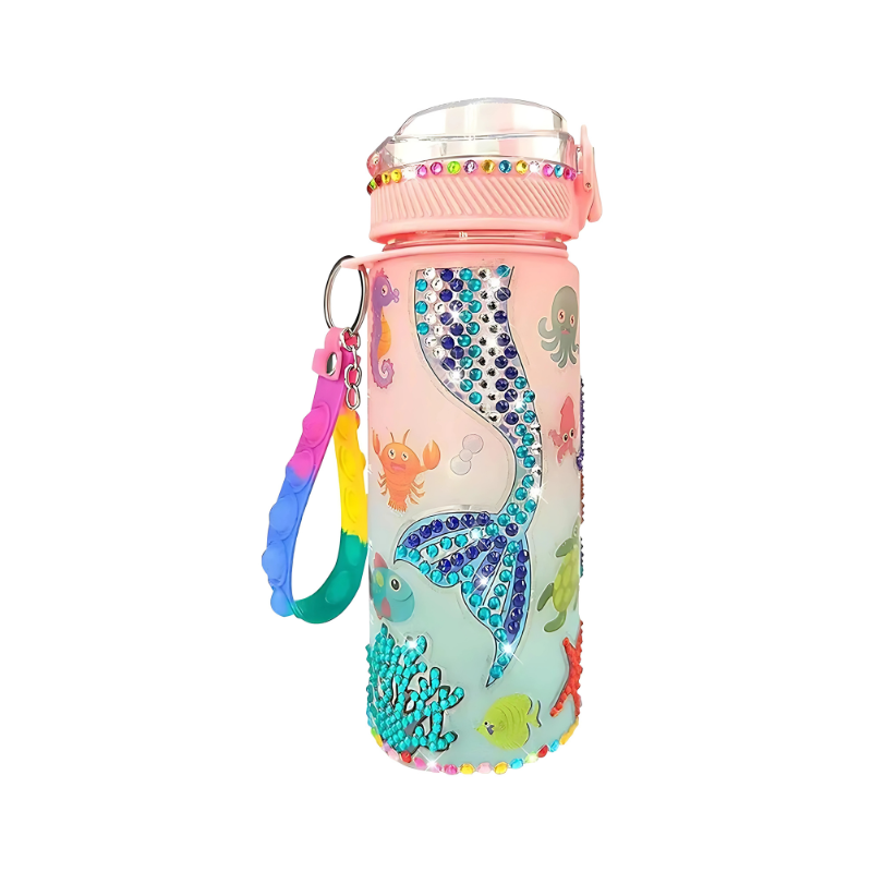 Assortment of craft supplies for kids' DIY glow-in-the-dark water bottle kit, including markers and gems, a creative learning toy.