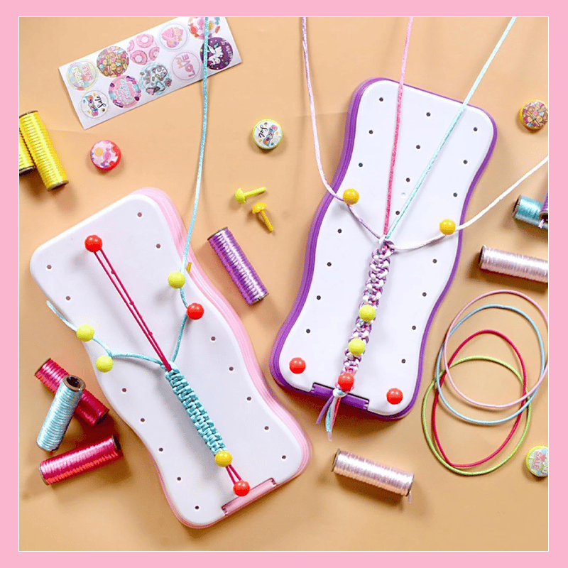 Two children engaged in a fun activity, creating bracelets together using the kids' knitting craft kits