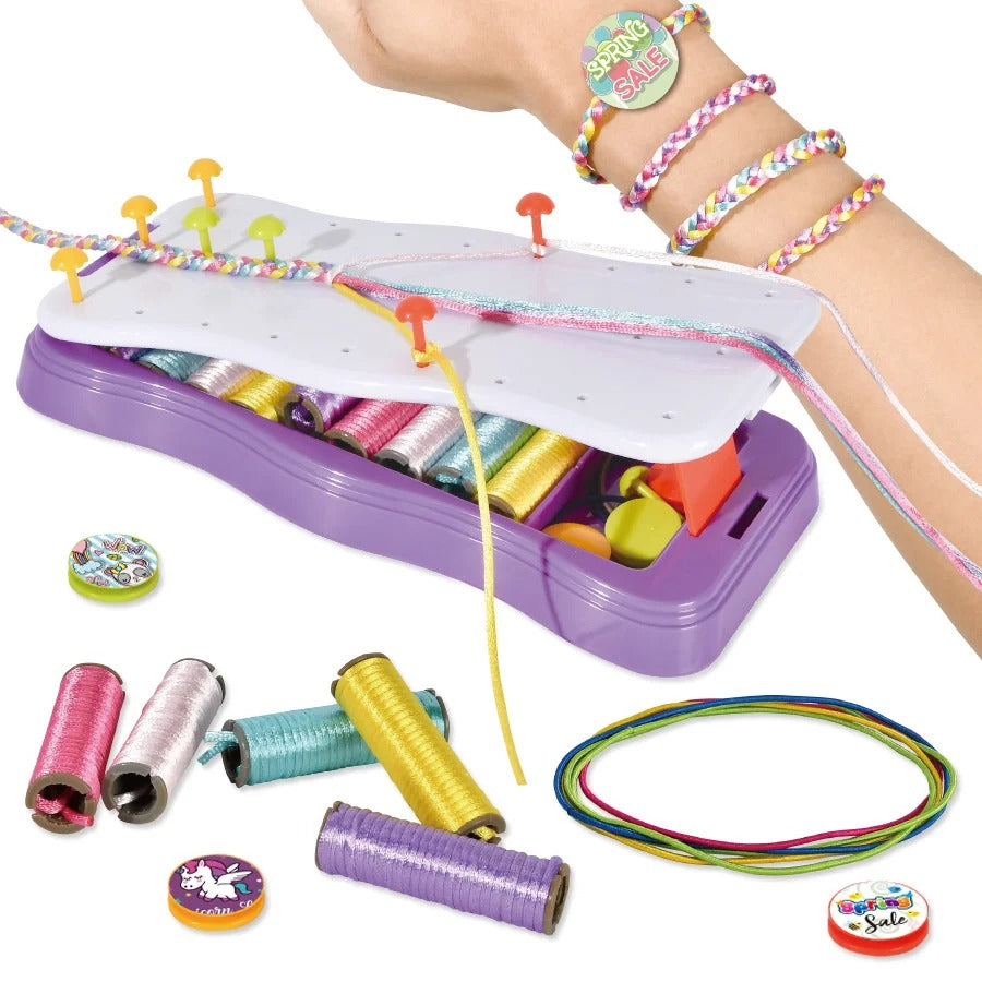 Child proudly displaying a handmade knitted bracelet crafted with the DIY educational toy kit
