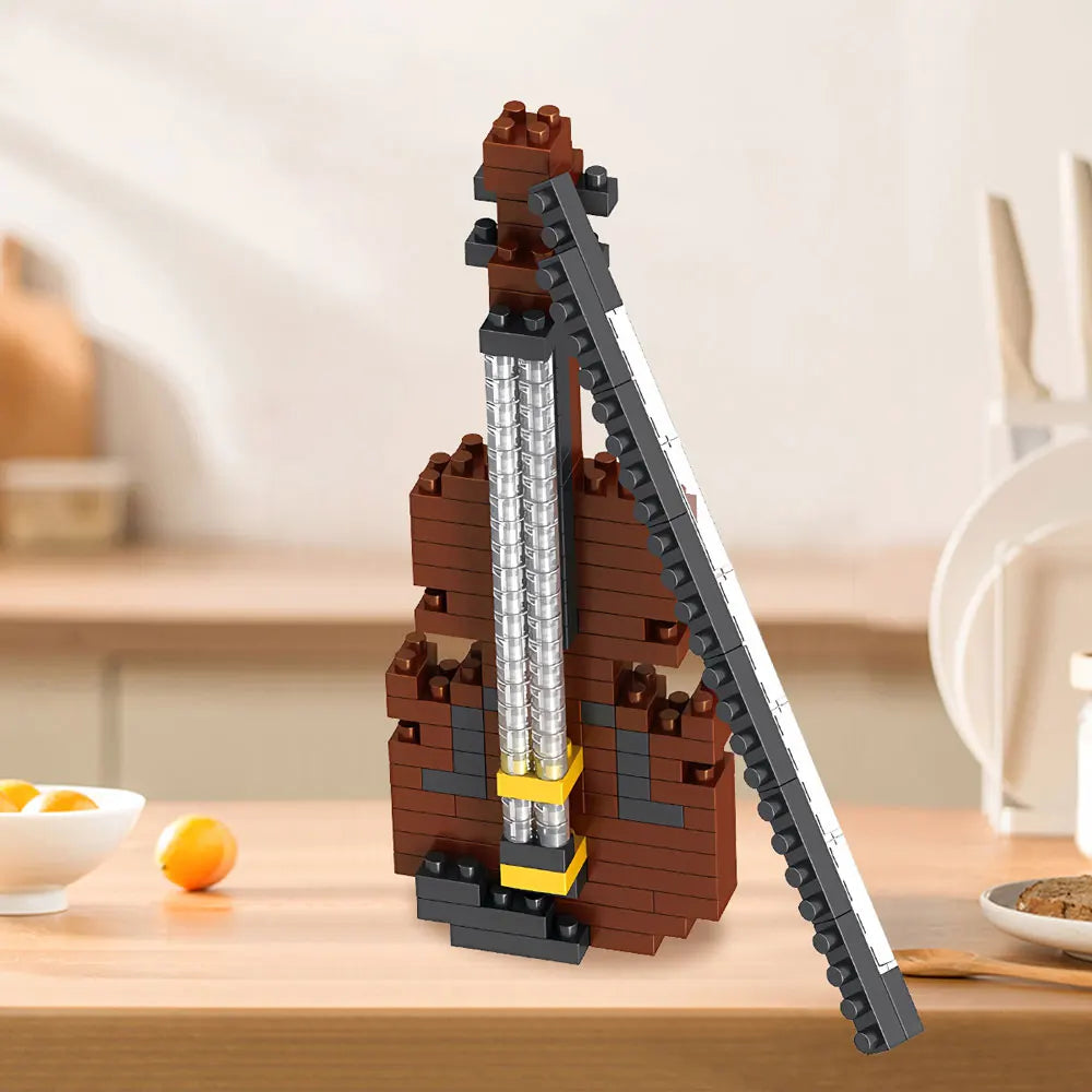 Close-up of child's hands building a DIY miniature guitar from toy kit