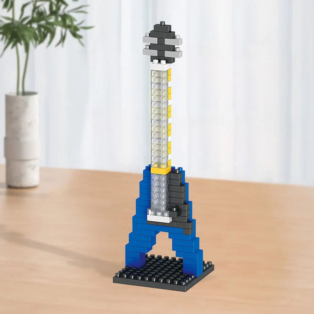 Colorful miniature musical instrument kit components laid out for DIY assembly