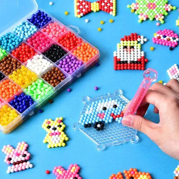 Kids DIY Water Fuse Beads Craft Kit, bright plastic beads, pegboards, spray bottle on a table