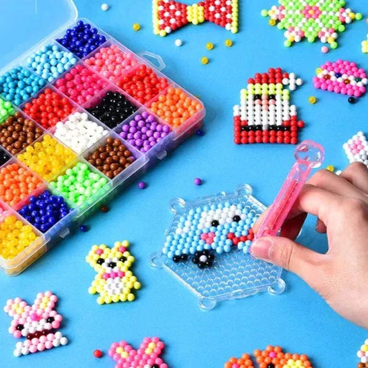 Kids DIY Water Fuse Beads Craft Kit, bright plastic beads, pegboards, spray bottle on a table