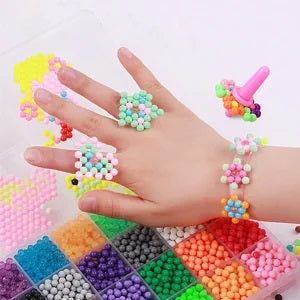 Creative play Water Fuse Beads kit for kids, close-up of fused bead shapes and various tools