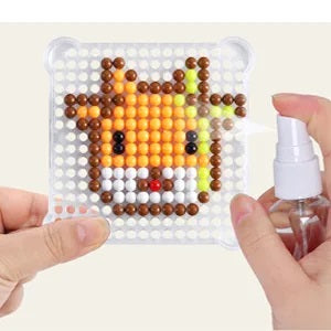 Kids activity DIY Water Fuse Beads craft kit, featuring vibrant beads, templates, and spray bottle