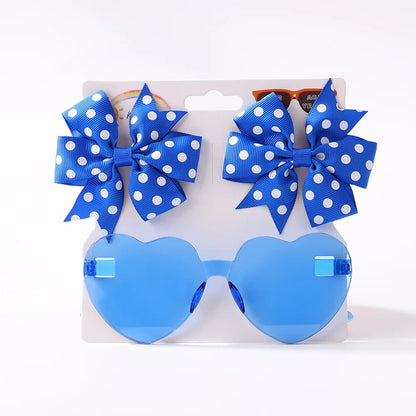Hand holding a wooden Dot Sunglasses Hairpin, showcasing vibrant design for toddlers