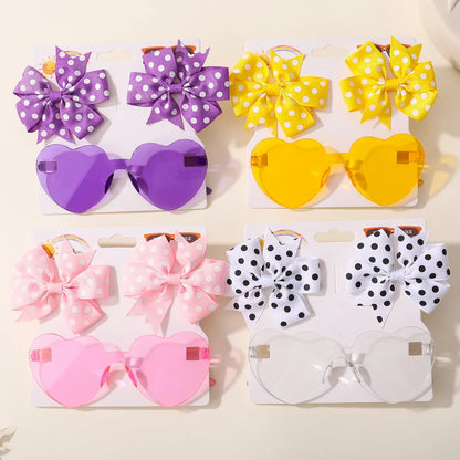 Toddler girl wearing a Dot & Heart Sunglasses Hairpin, colorful kids accessory