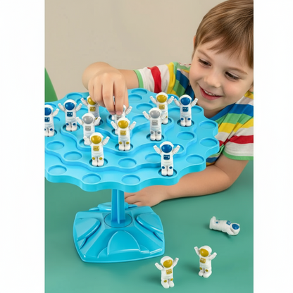 Child playing with Educational Balancing Tree Game, placing a character on the tree branches