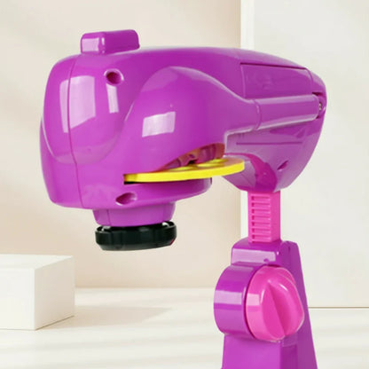 Smiling child actively engaged with a kids' art projector toy, fostering creative play and fine motor skills.