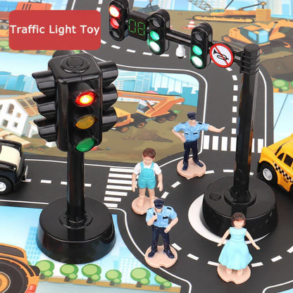 Child's hand placing a stop sign on a road mat in a traffic safety educational toy set