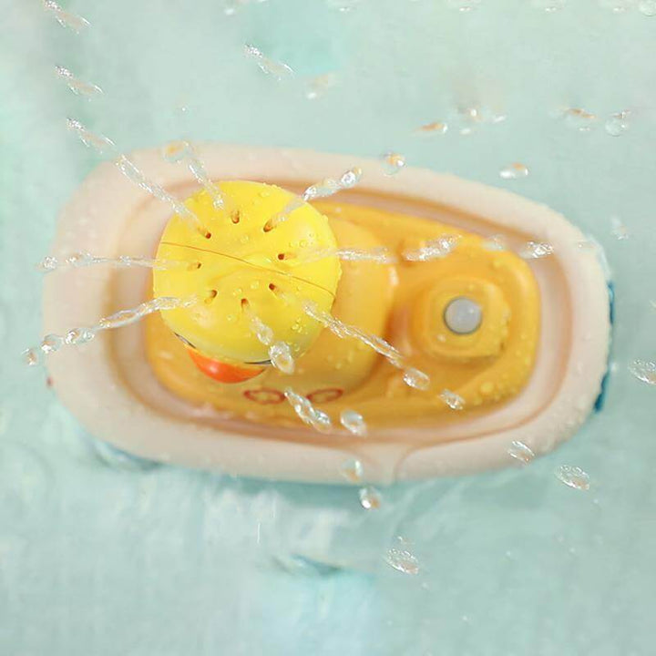 Floating electric duck bath toy with water spray, ideal for kids' water play & sensory fun in the tub. Toddler friendly.