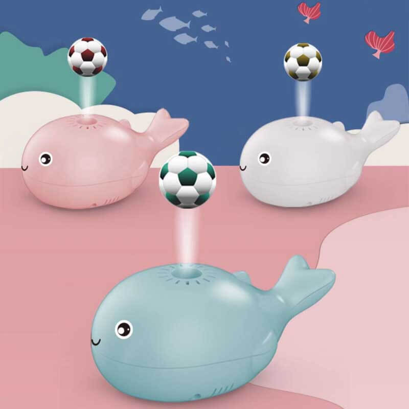 Child happily playing with an electric little whale hover ball, promoting active interactive play