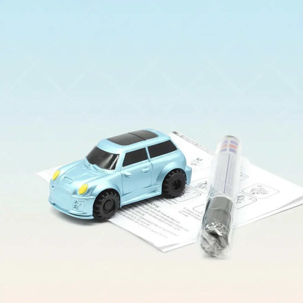 Child's hand drawing a line with a magic pen for their interactive toy car to follow