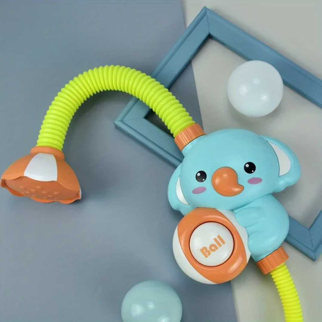 Close-up of elephant bath toy shower head with water spraying, encouraging early learning in children