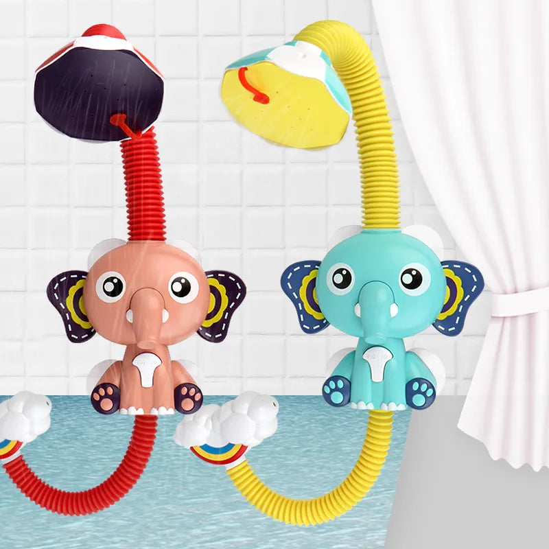 Toddler hand holding elephant shower toy, enjoying water spray during bath time, babytoy