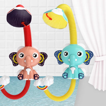 Toddler hand holding elephant shower toy, enjoying water spray during bath time, babytoy
