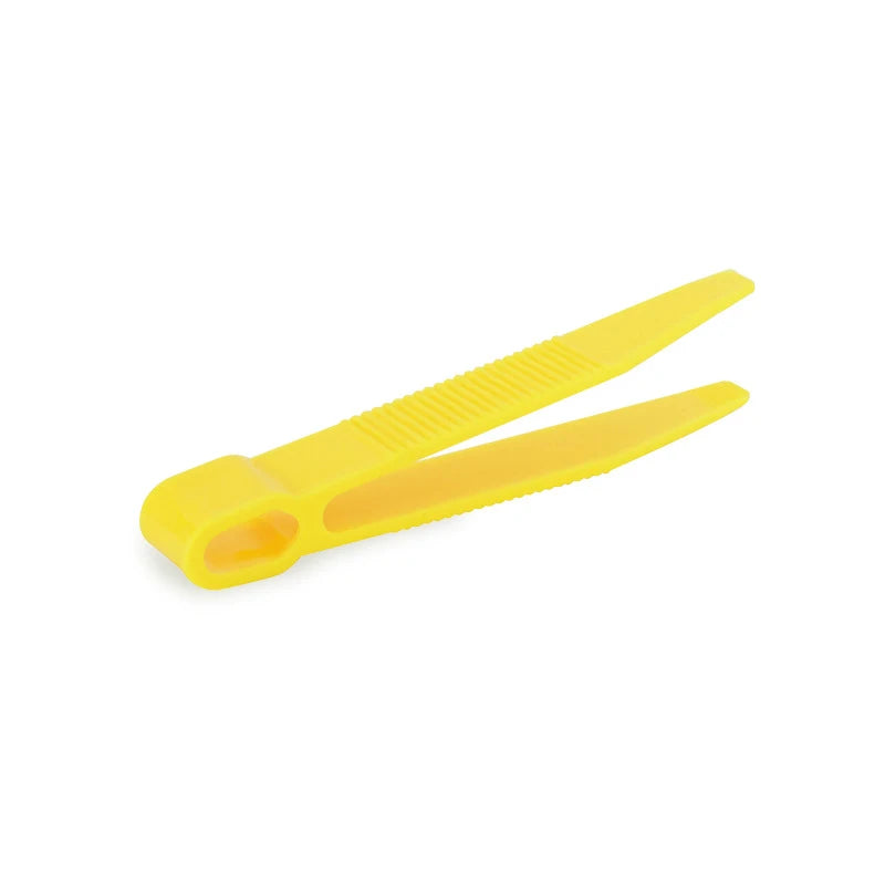 Kids' learning tweezers in red, yellow, and blue, promoting hand-eye coordination and motor skills
