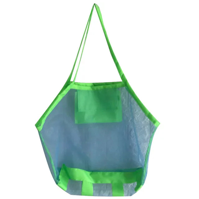 Green mesh beach bag for children, with handles, holding various beach toys.