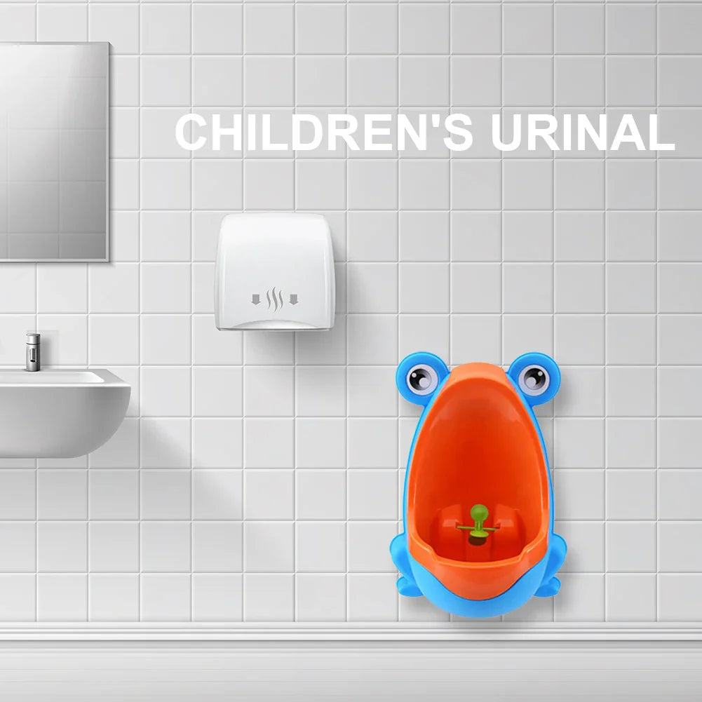 Wall-mounted frog urinal for kids' potty training, designed for toddler boys with a removable bowl.
