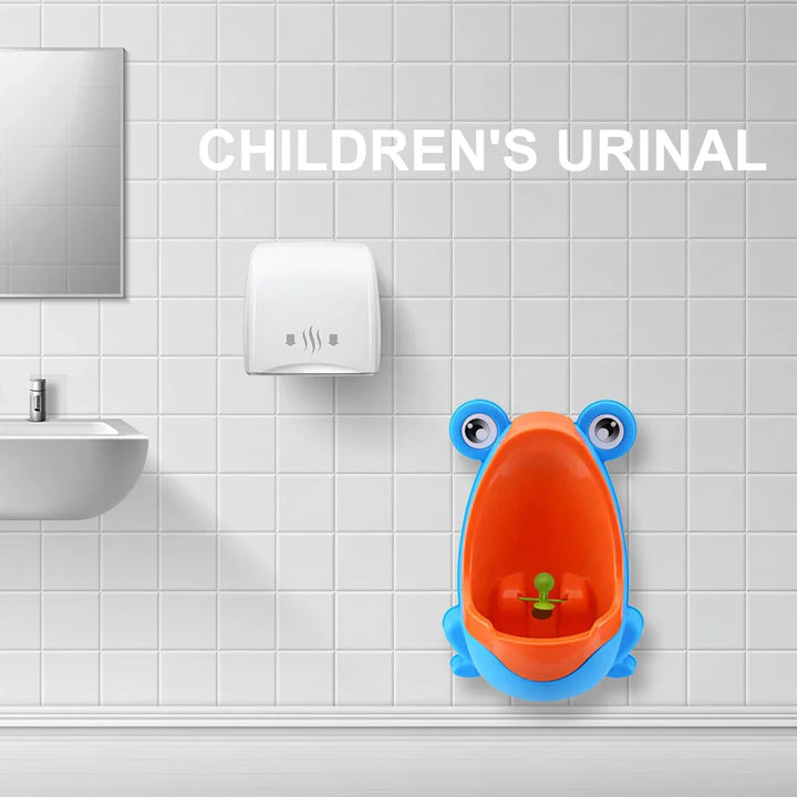 Wall-mounted frog urinal for kids' potty training, designed for toddler boys with a removable bowl.
