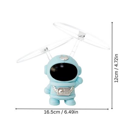 Astronaut drone for kids, hand-controlled, with bright LED lights, in a child's room.