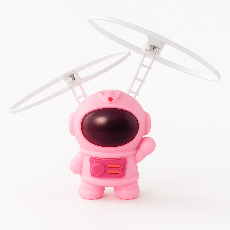 Close-up of a vibrant LED-lit hand-controlled flying astronaut toy for children.