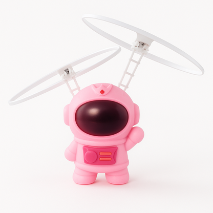 Close-up of a vibrant LED-lit hand-controlled flying astronaut toy for children.