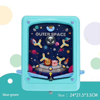 Child's hand holding a bright handheld 3D pinball game toy, engaging in active play.