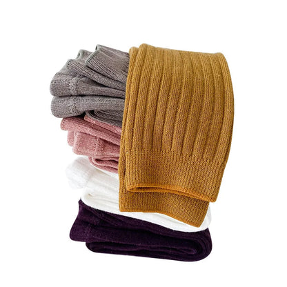 Stacked cotton blend leggings in various colors, essential for kids spring/autumn wardrobe