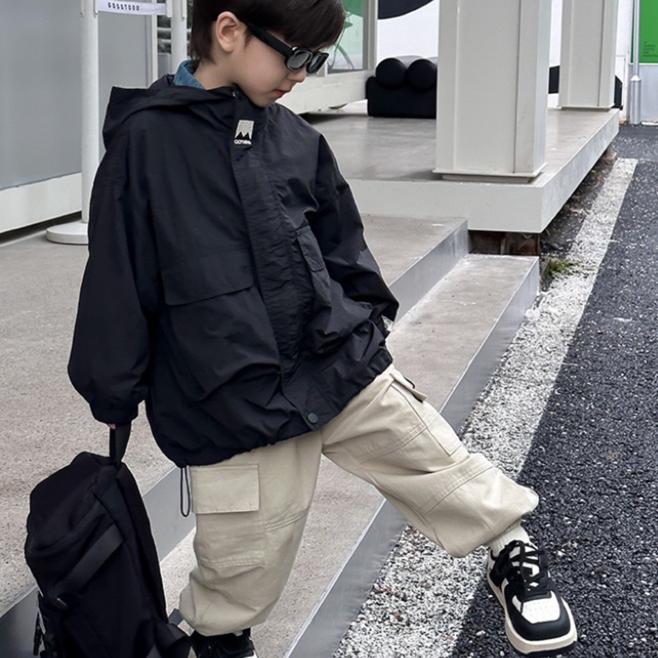 Red children's windbreaker jacket with hood, durable and weatherproof for boys & girls