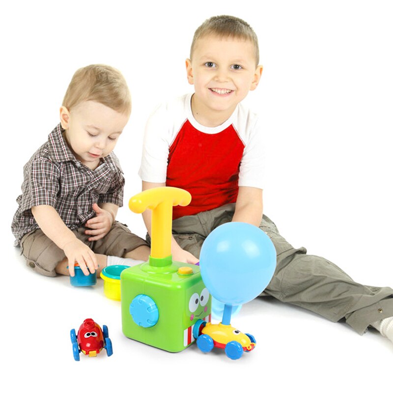 Blue balloon powered car racing across a floor, innovative STEM toy for young kids