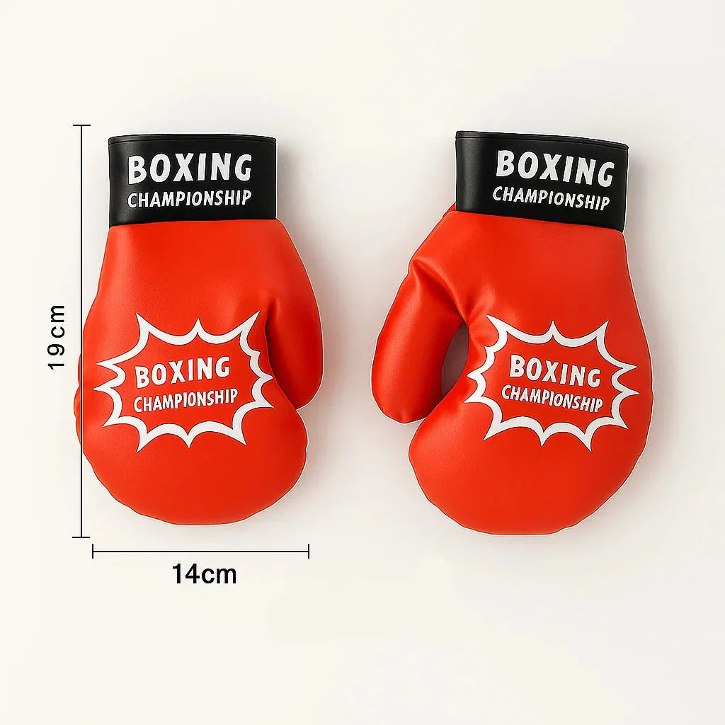 Close-up of kids' boxing gloves next to an inflatable punching bag ready for play