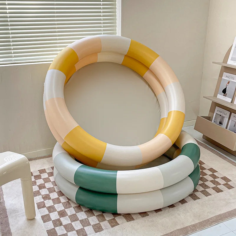 Kids' inflatable summer splash pool set with slide, perfect for backyard water play and fun activities.