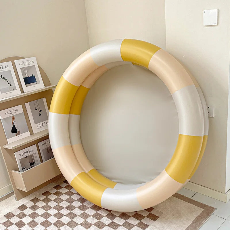 Durable PVC inflatable swimming pool for kids, featuring a sprinkler arch for endless backyard water fun.