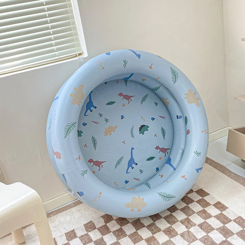 Toddler-friendly inflatable baby pool with soft sides and a playful splash zone, great for outdoor summer use.