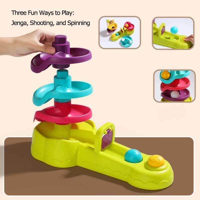 Toddler joyfully playing with an educational ball shooting & spinning activity toy, a great gift for kids