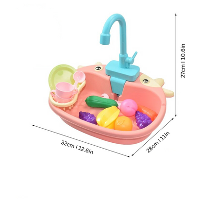 Toddler engaged in pretend play with a bright blue toy sink, functioning water faucet, and dish rack for developmental fun